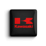 Glossy square clothing magnet with bold red custom logo on a black carbon fiber-style background.